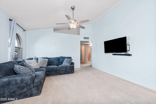 carpeted living room featuring ceiling fan, vaulted ceiling, and a textured ceiling