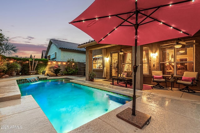 view of pool featuring a fenced in pool, a patio area, a fenced backyard, and ceiling fan