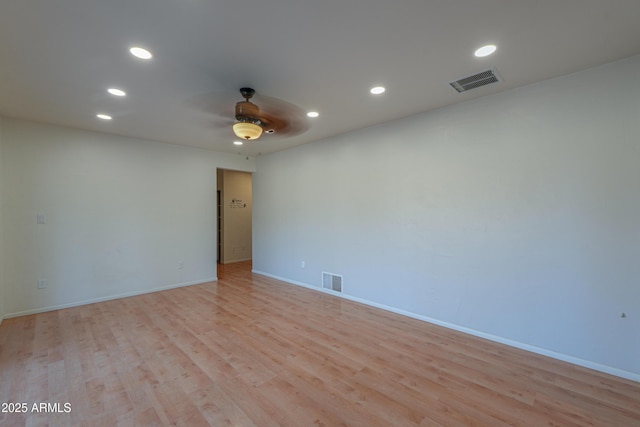 empty room with light hardwood / wood-style flooring