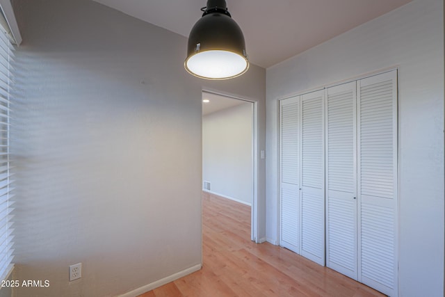 hallway featuring light wood-type flooring