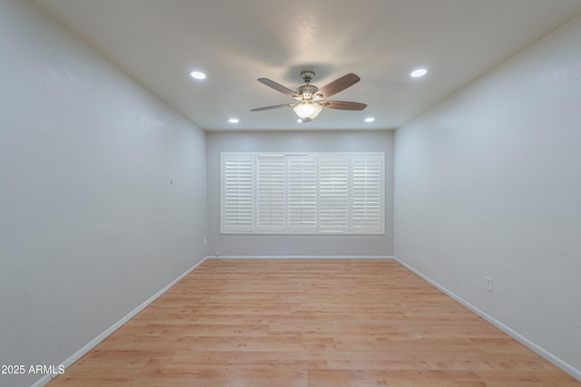 spare room featuring ceiling fan and light hardwood / wood-style floors