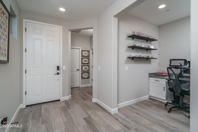 office area featuring baseboards, recessed lighting, and light wood-style floors