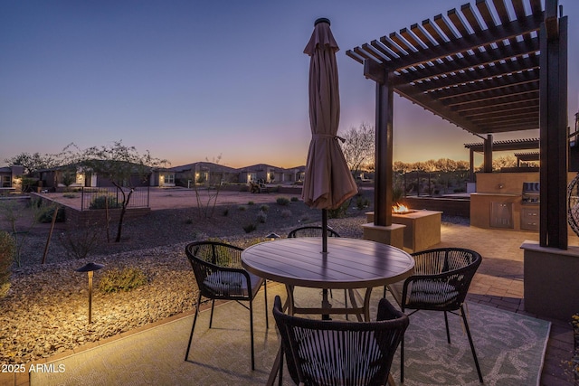 view of patio / terrace with a pergola and exterior kitchen