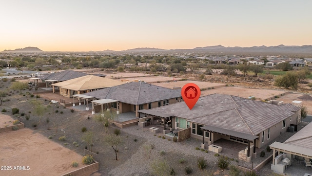 birds eye view of property featuring a mountain view