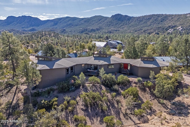 bird's eye view featuring a mountain view and a wooded view