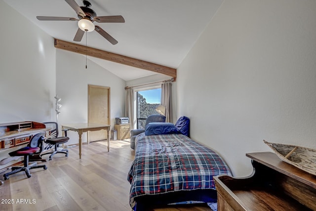 bedroom with ceiling fan, vaulted ceiling with beams, and wood finished floors