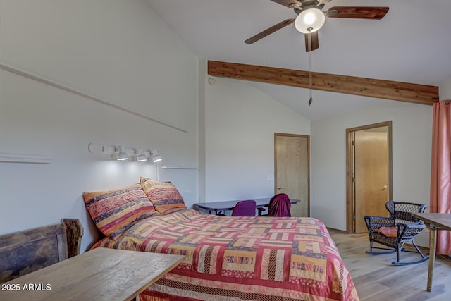 bedroom with vaulted ceiling with beams, light wood-style flooring, and a ceiling fan