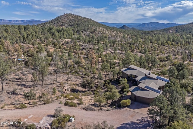 aerial view with a forest view and a mountain view