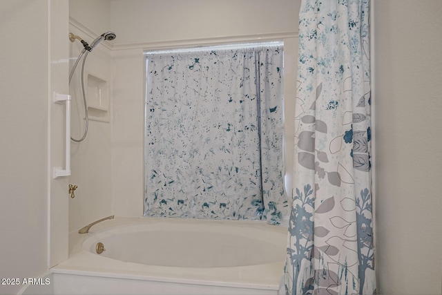 full bathroom featuring shower / bath combo with shower curtain