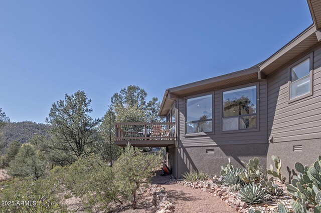 view of side of property with a deck