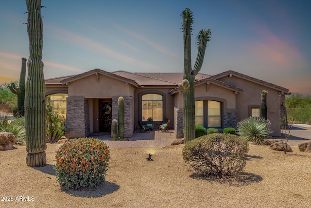 8725 E Menlo Cir, Mesa, AZ 85207 - view of front of property featuring stucco siding, stone siding, and a tiled roof