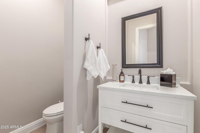 8725 E Menlo Cir, Mesa, AZ 85207 - bathroom featuring vanity, toilet, and baseboards