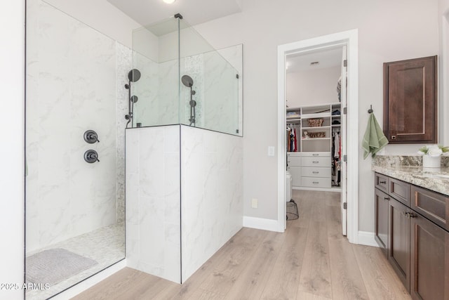 8725 E Menlo Cir, Mesa, AZ 85207 - full bathroom featuring wood finished floors, a marble finish shower, and vanity
