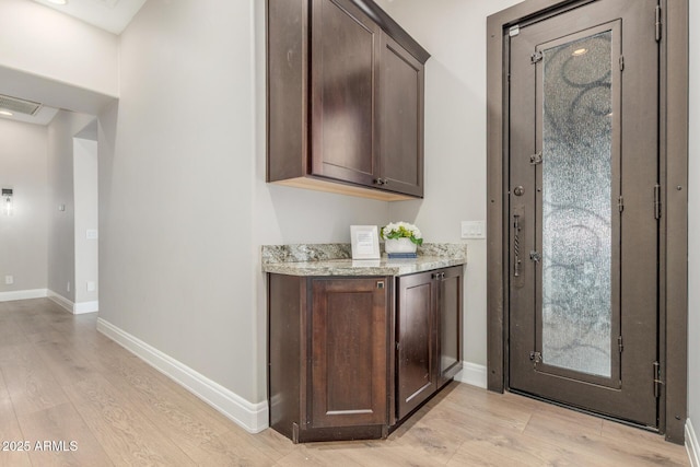 8725 E Menlo Cir, Mesa, AZ 85207 - indoor bar with light wood finished floors and baseboards