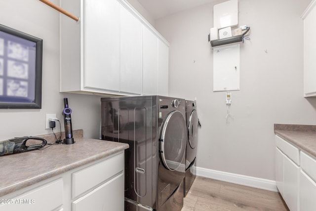 8725 E Menlo Cir, Mesa, AZ 85207 - laundry area featuring light wood-style flooring, washer and clothes dryer, cabinet space, and baseboards