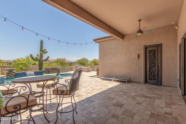 8725 E Menlo Cir, Mesa, AZ 85207 - fenced backyard with ceiling fan and a patio