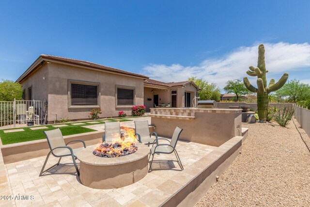 8725 E Menlo Cir, Mesa, AZ 85207 - view of patio with an outdoor fire pit