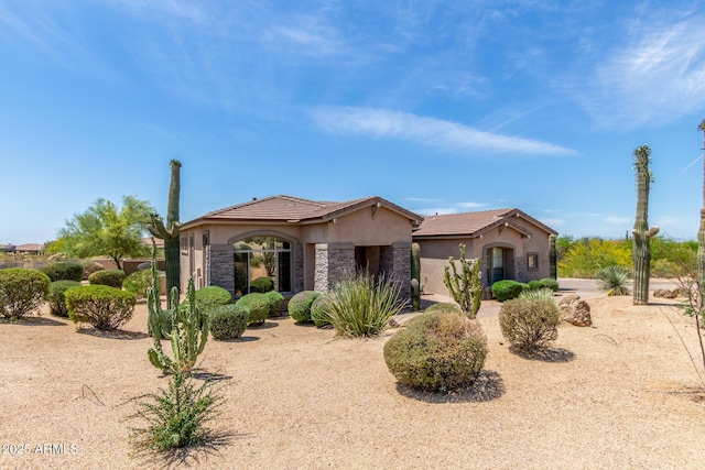8725 E Menlo Cir, Mesa, AZ 85207 - view of front of house with stucco siding, a tiled roof, and stone siding