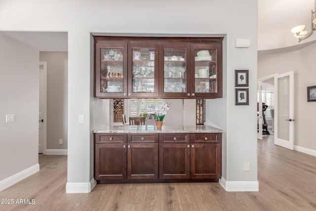 8725 E Menlo Cir, Mesa, AZ 85207 - bar area with light wood-type flooring and baseboards