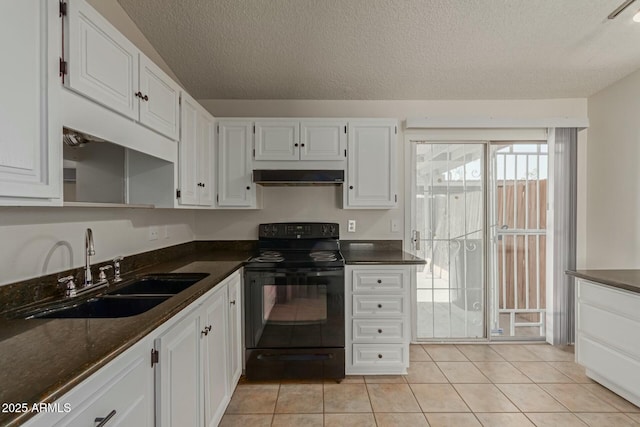 kitchen with white cabinets, a sink, wall chimney range hood, and black / electric stove