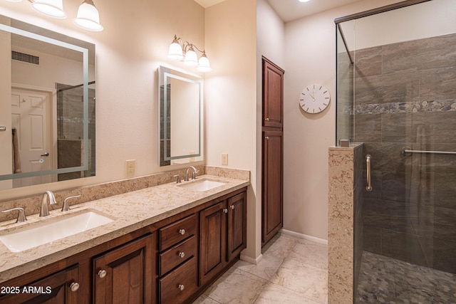 bathroom featuring vanity and a tile shower