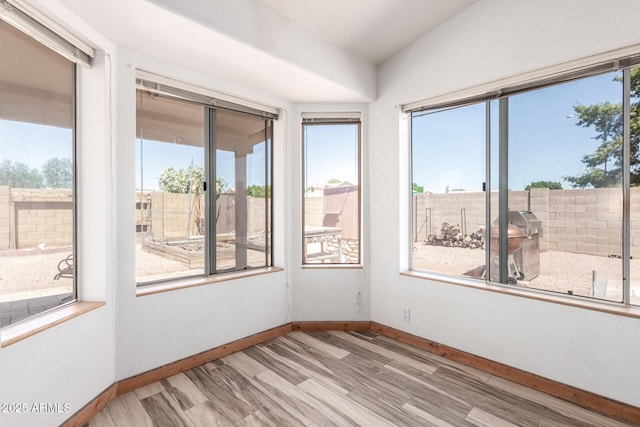 2356 N Glenview, Mesa, AZ 85213 - empty room with baseboards, light wood-type flooring, a wealth of natural light, and lofted ceiling