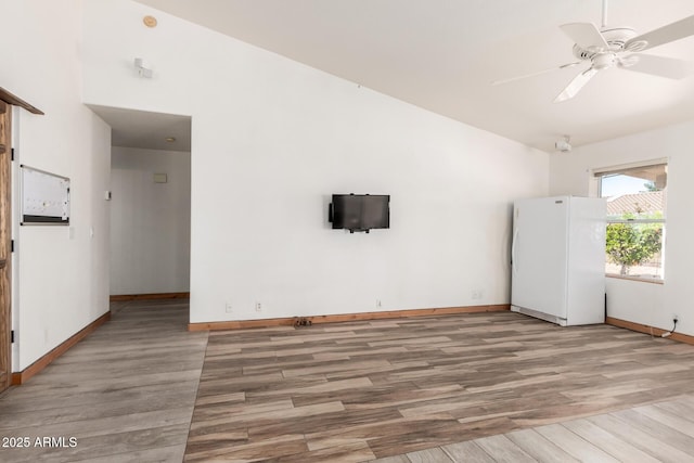 2356 N Glenview, Mesa, AZ 85213 - spare room featuring baseboards, wood finished floors, ceiling fan, and vaulted ceiling