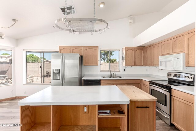 2356 N Glenview, Mesa, AZ 85213 - kitchen with lofted ceiling, open shelves, a sink, stainless steel appliances, and a center island