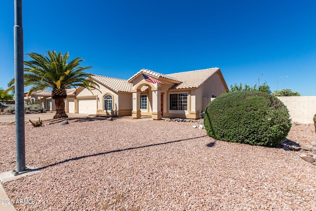 2356 N Glenview, Mesa, AZ 85213 - mediterranean / spanish-style home with a tile roof, driveway, a garage, and stucco siding