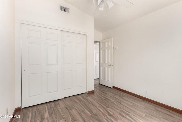 2356 N Glenview, Mesa, AZ 85213 - unfurnished bedroom featuring a closet, visible vents, wood finished floors, and baseboards