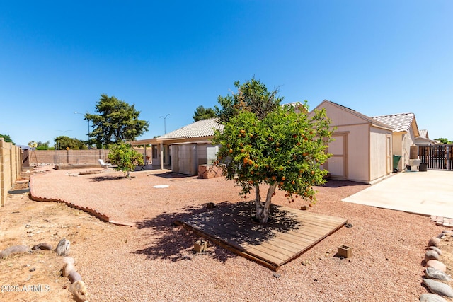 2356 N Glenview, Mesa, AZ 85213 - back of house featuring a fenced backyard, a shed, an outbuilding, and a patio area