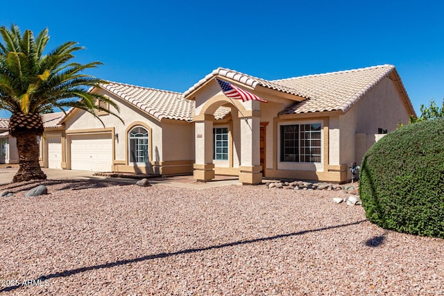 2356 N Glenview, Mesa, AZ 85213 - mediterranean / spanish-style home with concrete driveway, stucco siding, a tiled roof, and an attached garage