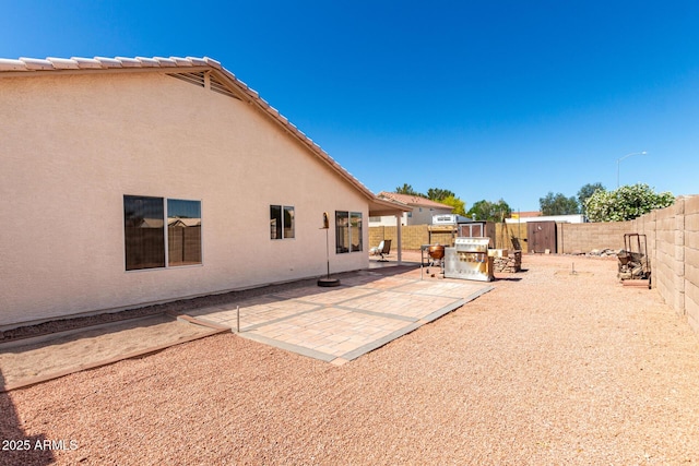 2356 N Glenview, Mesa, AZ 85213 - back of property featuring stucco siding, a patio, and a fenced backyard