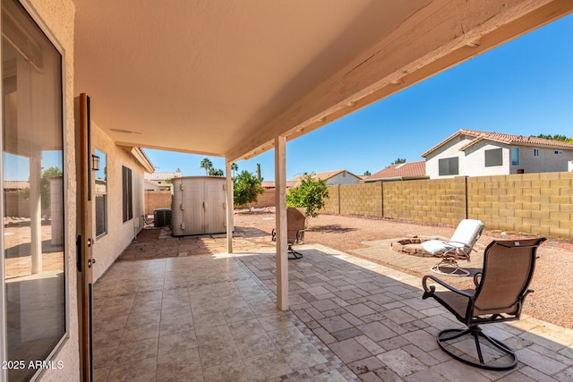 2356 N Glenview, Mesa, AZ 85213 - view of patio featuring central AC, a fenced backyard, an outbuilding, and a storage shed