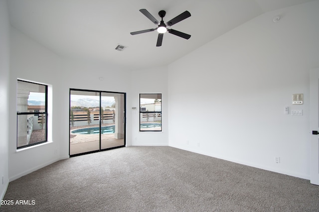 unfurnished room featuring ceiling fan, carpet flooring, and high vaulted ceiling