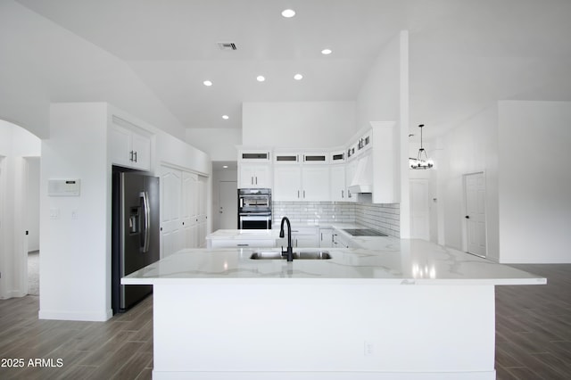 kitchen with white cabinetry, sink, kitchen peninsula, and black appliances