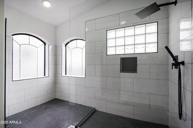 bathroom with tiled shower