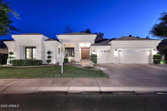 2041 W Hemlock Way, Chandler, AZ 85248 - view of front facade featuring an attached garage, concrete driveway, a front yard, and stucco siding