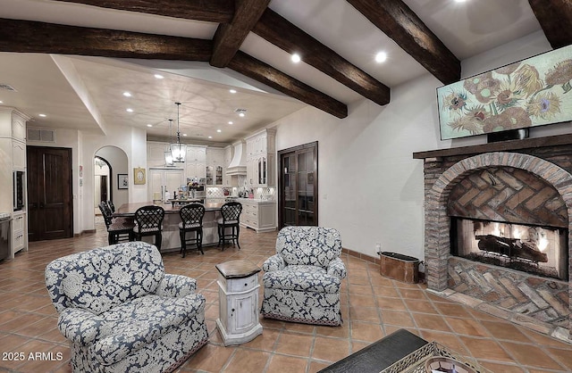 2041 W Hemlock Way, Chandler, AZ 85248 - living area featuring beam ceiling, recessed lighting, tile patterned flooring, arched walkways, and baseboards