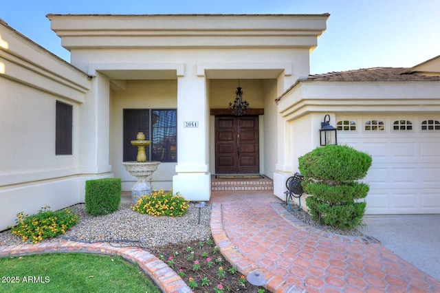 2041 W Hemlock Way, Chandler, AZ 85248 - view of exterior entry featuring stucco siding and an attached garage