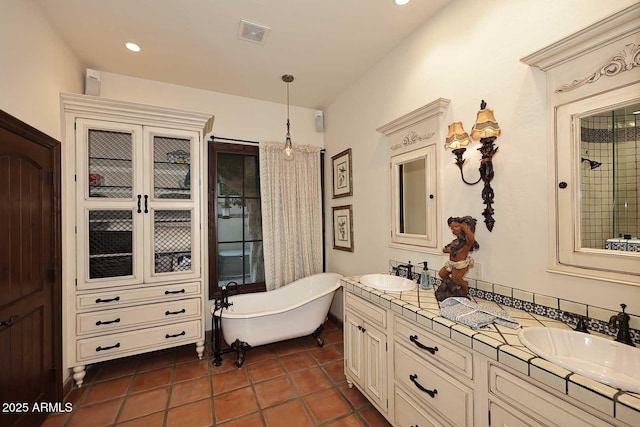 2041 W Hemlock Way, Chandler, AZ 85248 - full bath featuring a freestanding tub, double vanity, and tile patterned floors