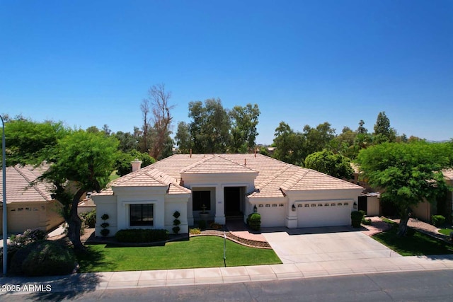 2041 W Hemlock Way, Chandler, AZ 85248 - view of front facade with an attached garage, driveway, a front lawn, a tile roof, and stucco siding