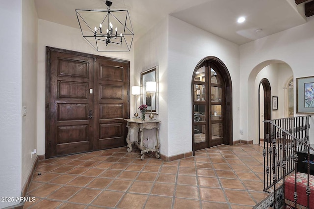 2041 W Hemlock Way, Chandler, AZ 85248 - entrance foyer featuring baseboards, a chandelier, and tile patterned floors