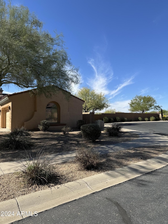 view of side of property featuring a garage