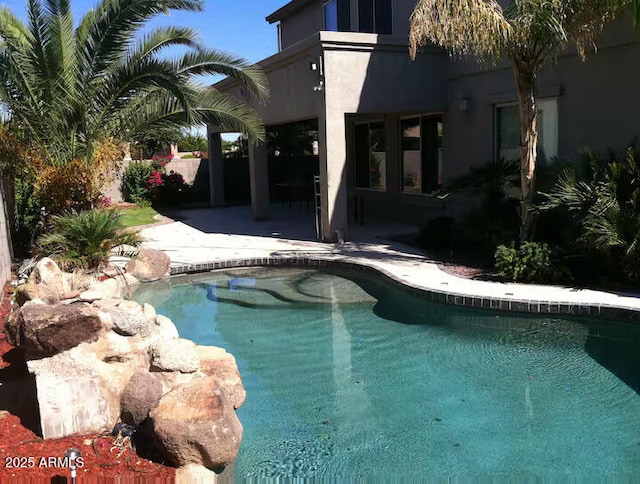 view of swimming pool with a patio