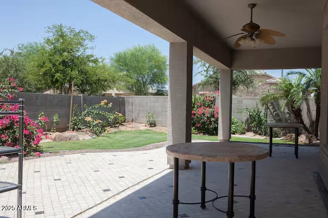 view of patio / terrace featuring ceiling fan