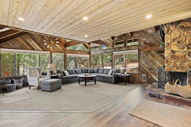 4511 N Ponderosa Dr, Pine, AZ 85544 - living area with wood ceiling, wooden walls, wood finished floors, vaulted ceiling, and a fireplace