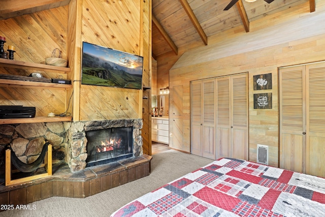 4511 N Ponderosa Dr, Pine, AZ 85544 - bedroom featuring wooden walls, wooden ceiling, carpet, and a stone fireplace