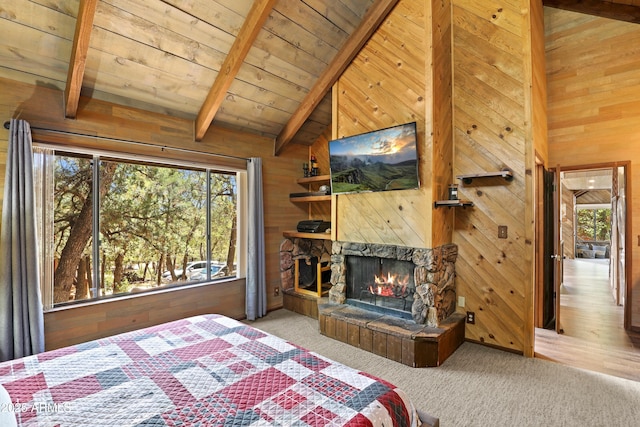 4511 N Ponderosa Dr, Pine, AZ 85544 - carpeted bedroom featuring wooden walls, multiple windows, a fireplace, and wood ceiling