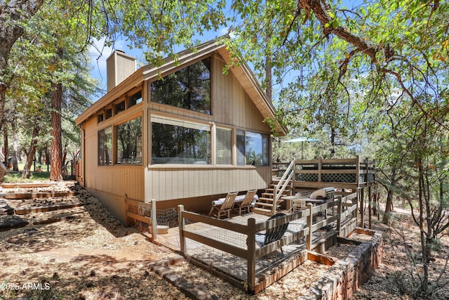 4511 N Ponderosa Dr, Pine, AZ 85544 - view of front of house featuring a chimney, stairway, and a wooden deck